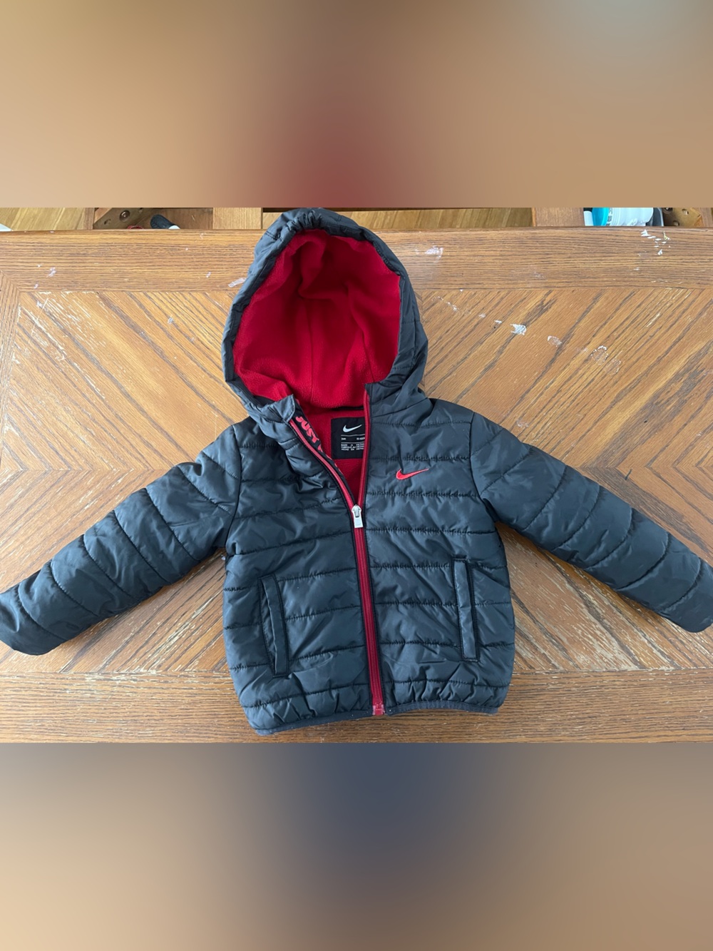 Nike Kids Black Puffer Jacket with Red Lining and Hood